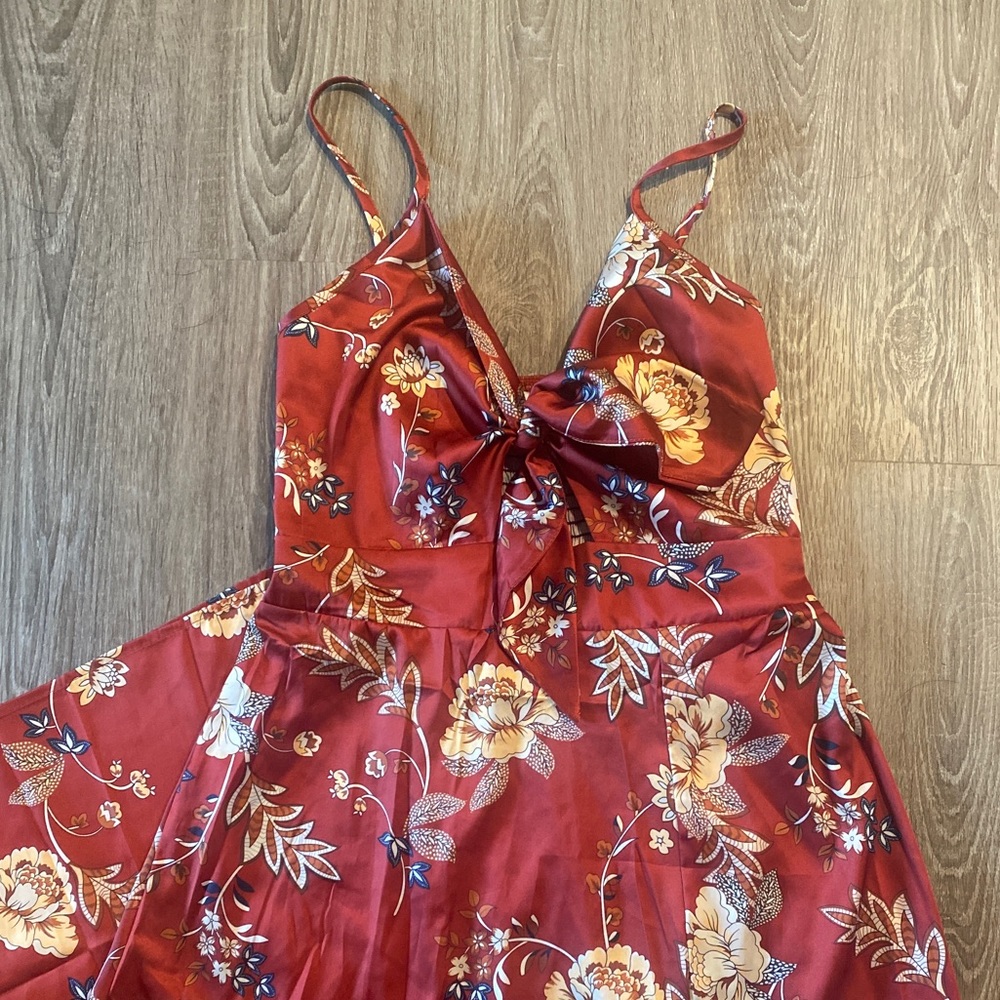 satin midi dress. adjustable straps, leg slit and front tie.
